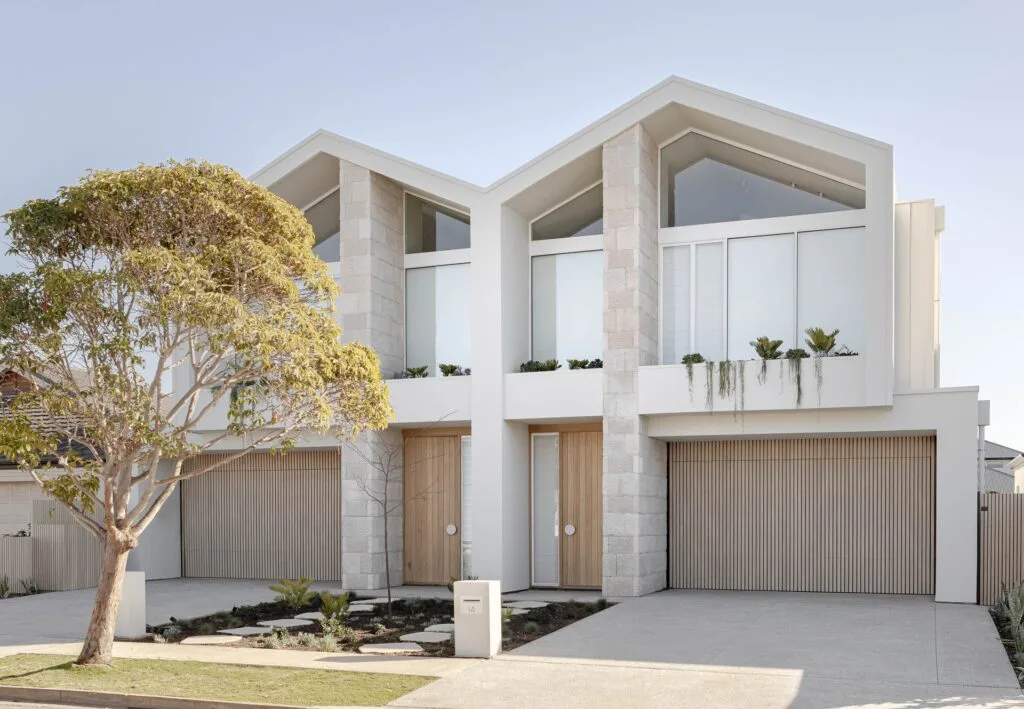 Modern duplexes with a stone facade and clerestory windows.