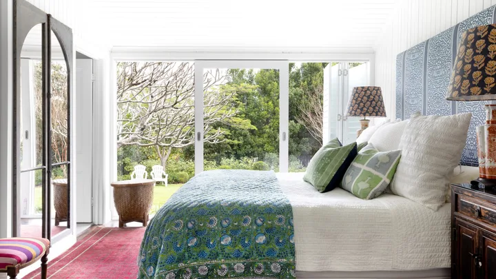 The main bedroom opening onto the cottage garden.