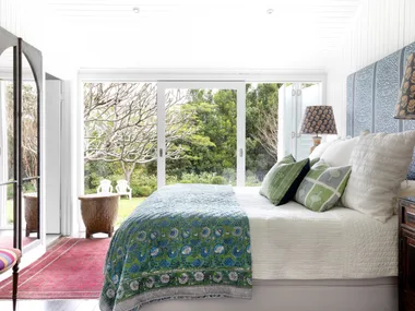 The main bedroom opening onto the cottage garden.