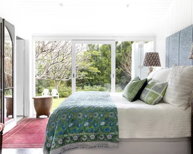 The main bedroom opening onto the cottage garden.