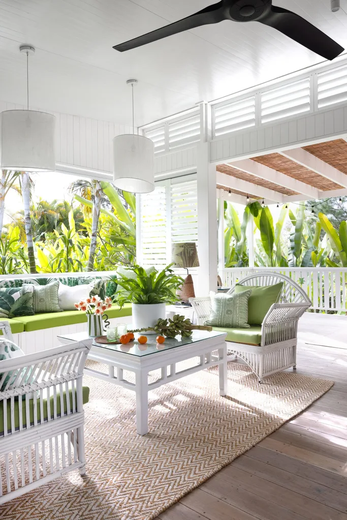 The outdoor lounge area surrounded by tropical greenery.
