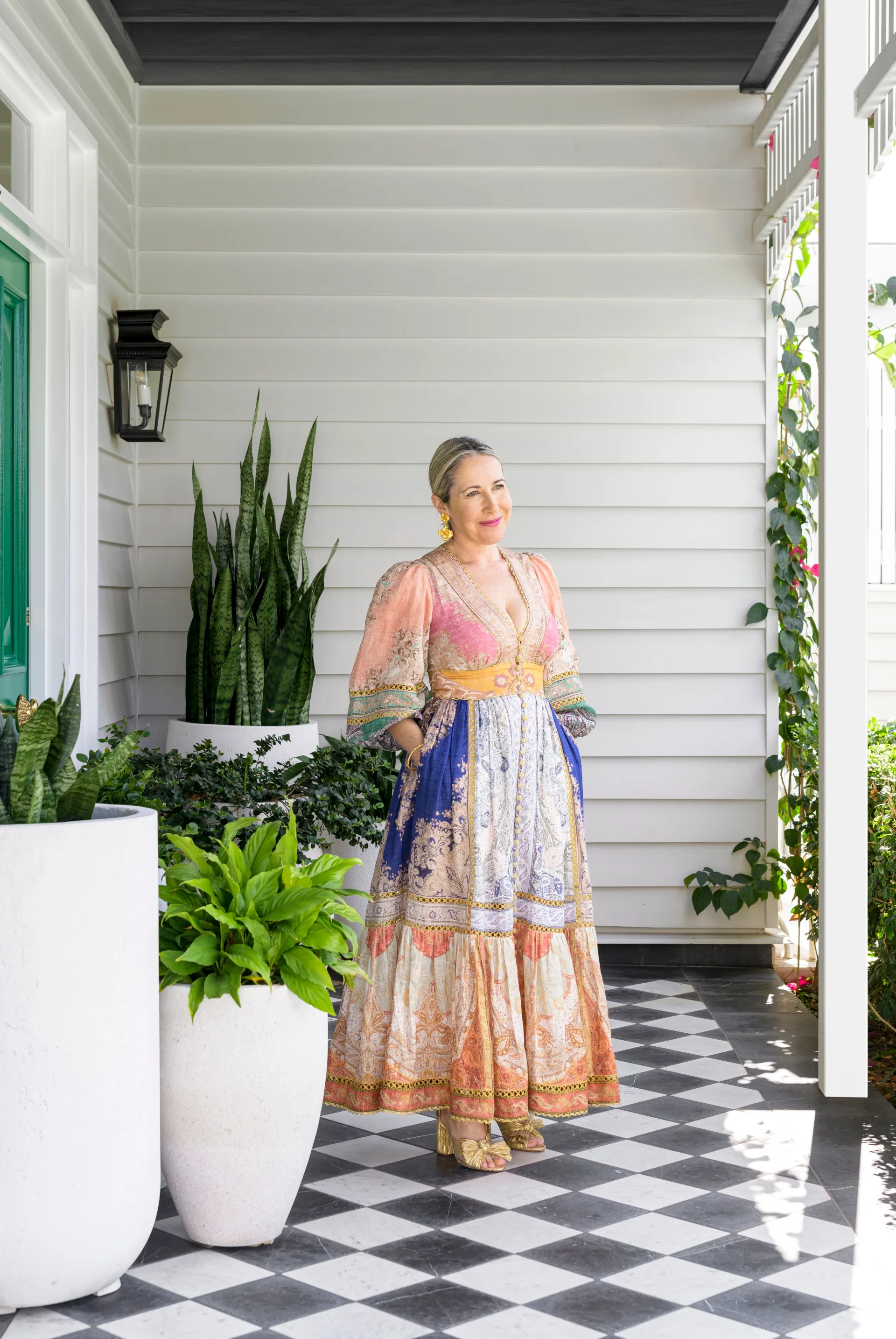 Interior designer Tori standing at the cottage entrance.