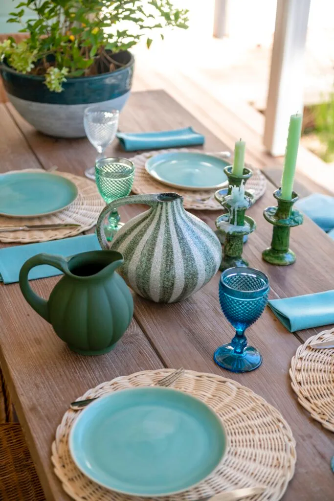 A tablescape with blue and green crockery.