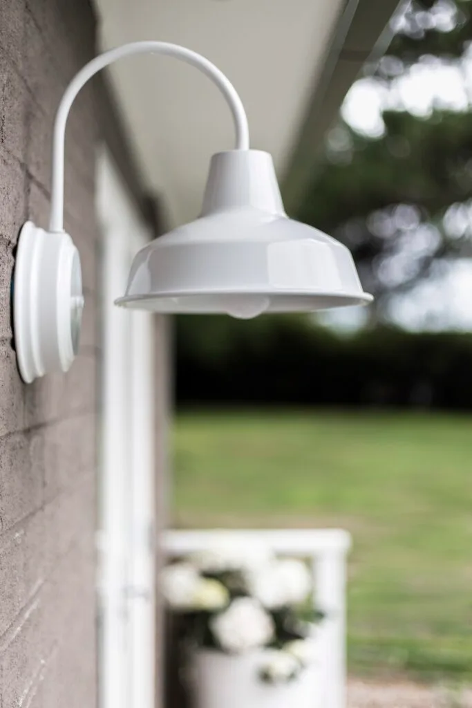 A round white outdoor light.