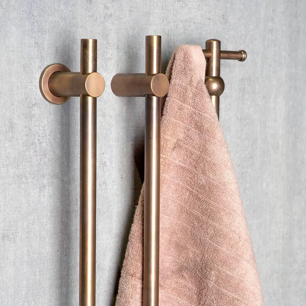 Three brass towel holders.