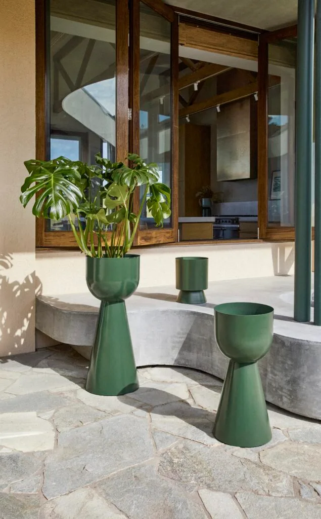 A collection of rounded green planters.