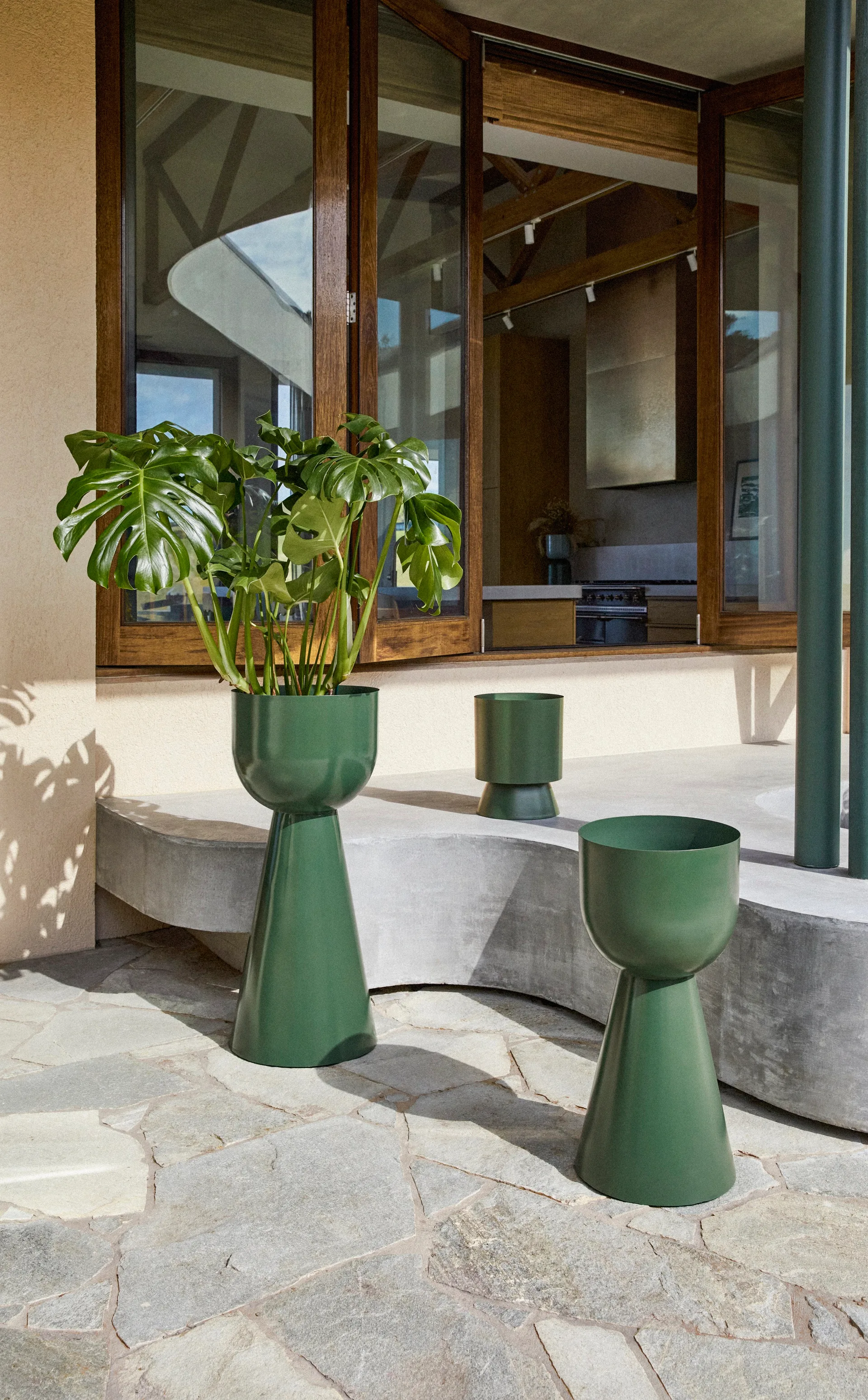 A collection of rounded green planters.
