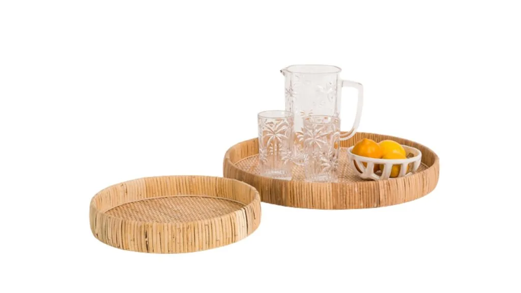 Two round woven rattan trays.