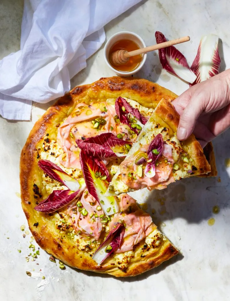 A mozzarella, pistachio and mortadella pizza.