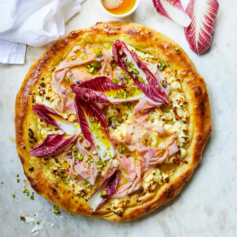 A mozzarella, pistachio and mortadella pizza.