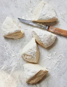 Cut pieces of pizza dough.