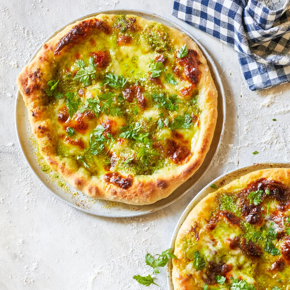 Round servings of pizza verde.