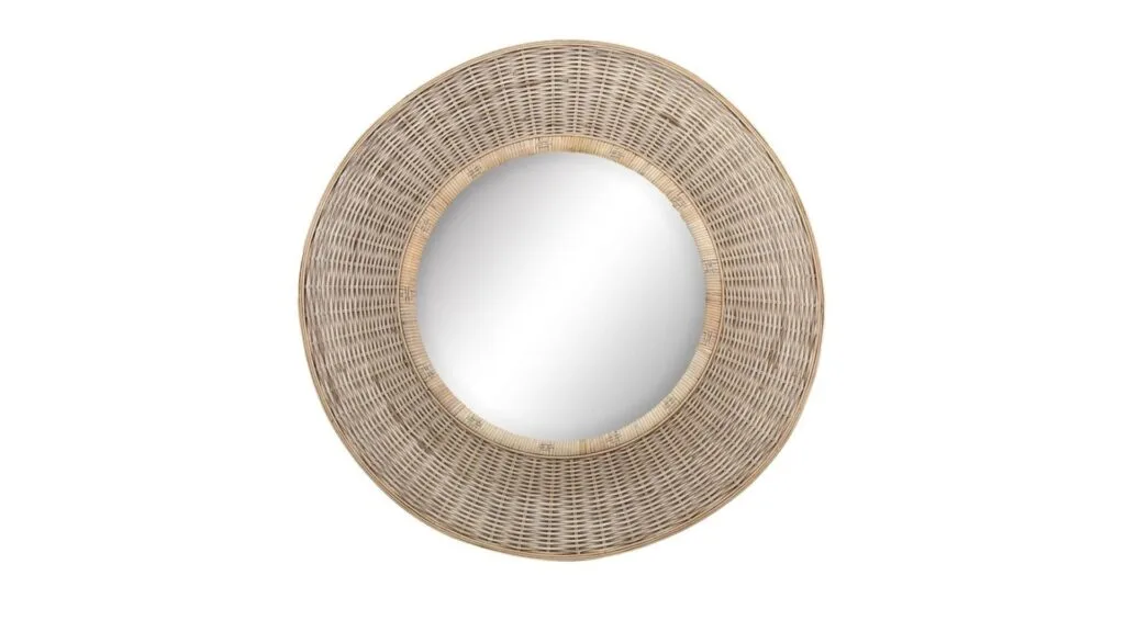 A circular rattan wall mirror.