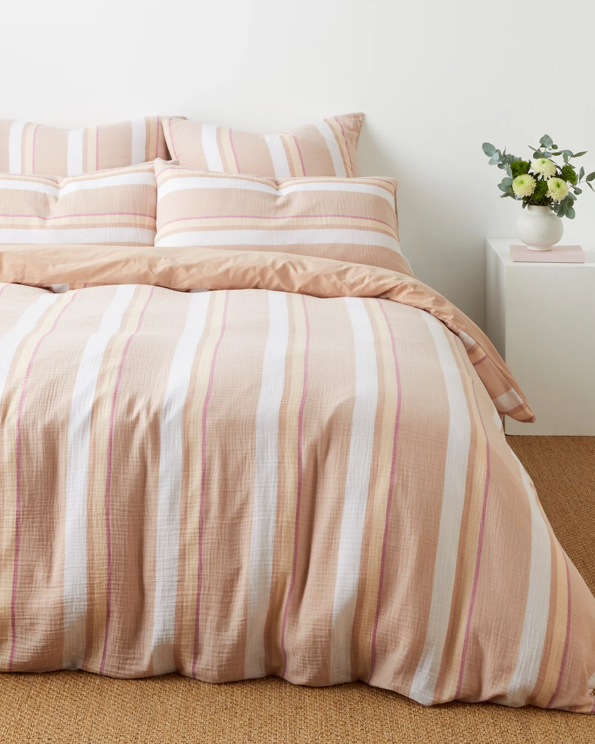 A pink striped quilt from target. 