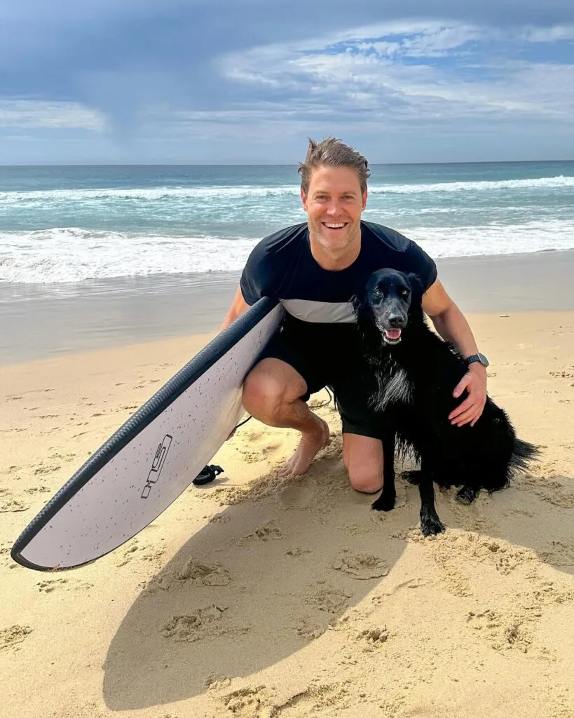 Dream Home TV Show Host Dr Chris Brown With His Dog On The Beach