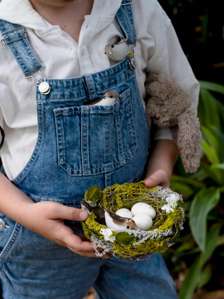 Easter Egg Hunt Child Holding Nest With Eggs