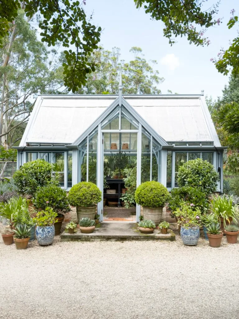 Easter Egg Hunt Green House With Pot Plants At Front