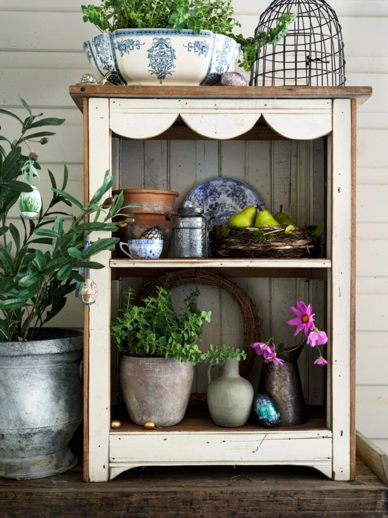 Easter Egg Hunt Outdoor Shelves With Pot Plants And Easter Eggs