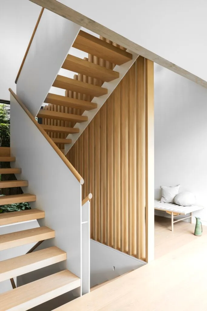 A white and timber stairwell.