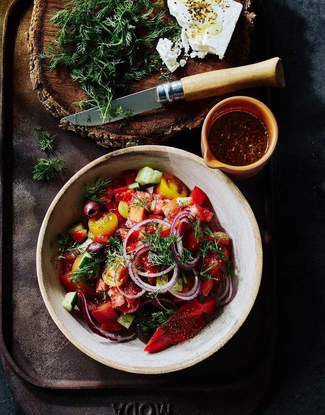 A chopped Greek salad in a bowl.