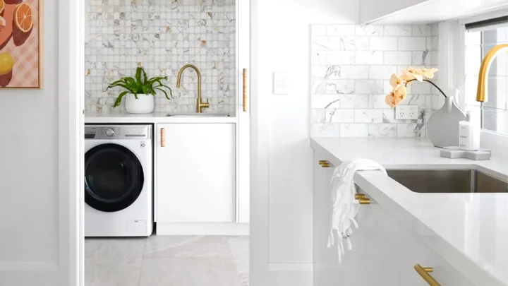 White and marble kitchen leading into a combined laundry and butlers pantry