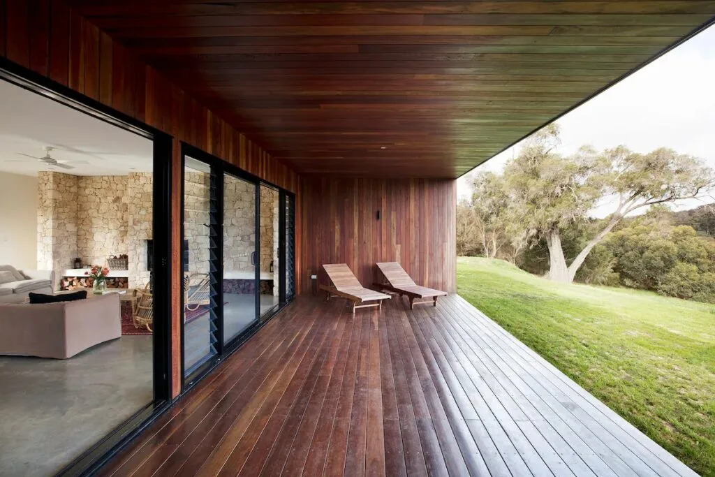 A modern timber deck opening onto the trees.