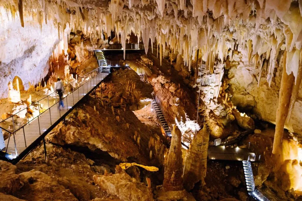 A wide cave with stalactites.