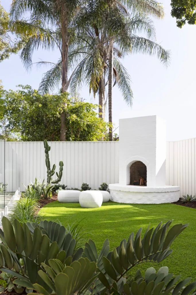 A white, Mediterranean style outdoor area.