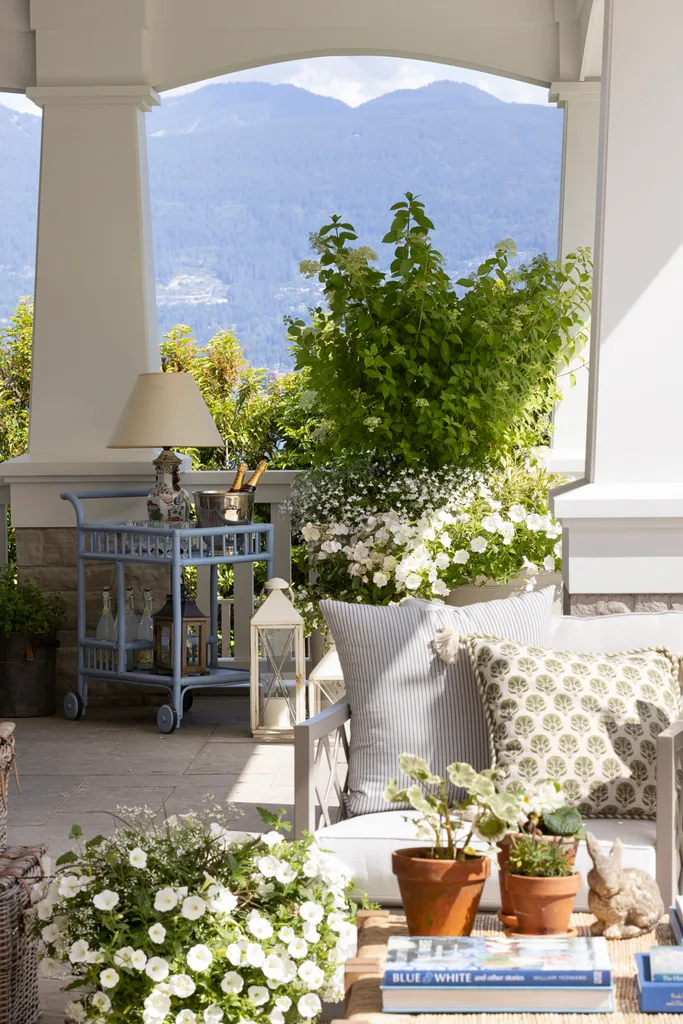 A blue bar cart in the outdoor alfresco area.