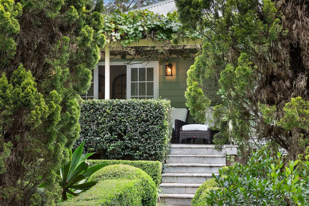 View of Charlie Albone's Ourimbah home view through tree foliage.