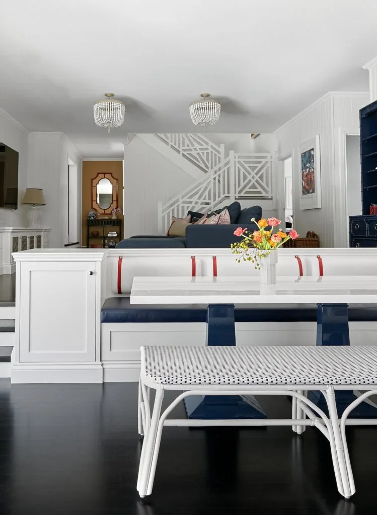 A white, blue and red accented banquette leading to the stairwell.