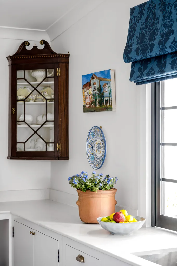 A vintage wooden cabinet above a kitchen benchtop.
