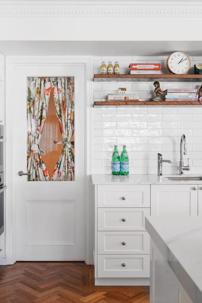 colourful-dream-home-brisbane-white-kitchen-floral-door-curtain