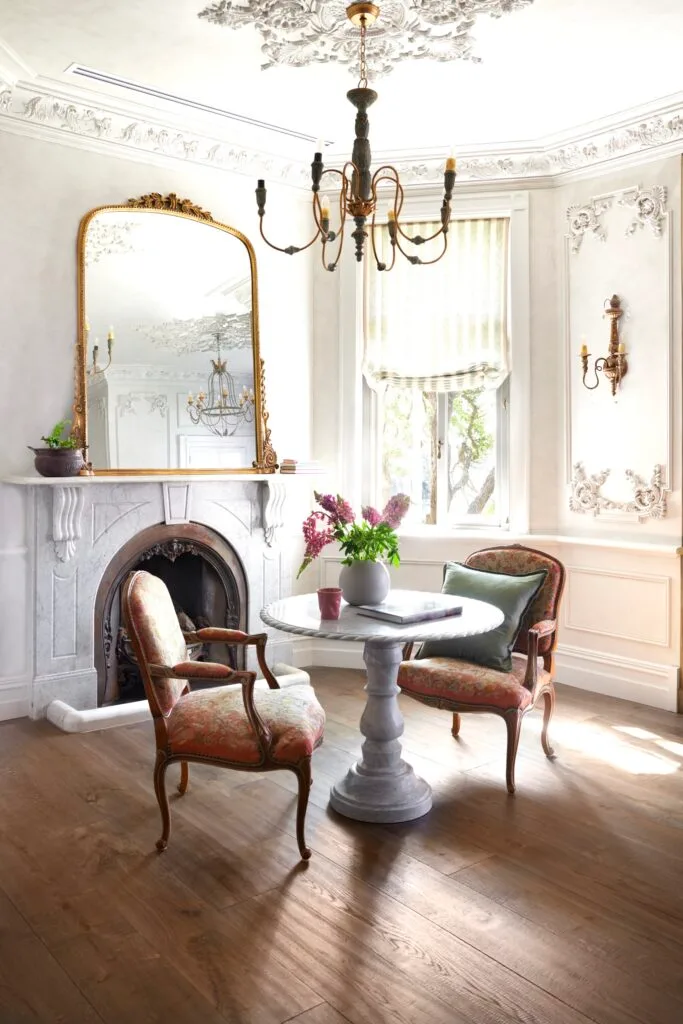 A French provincial style sitting area in the main bedroom.