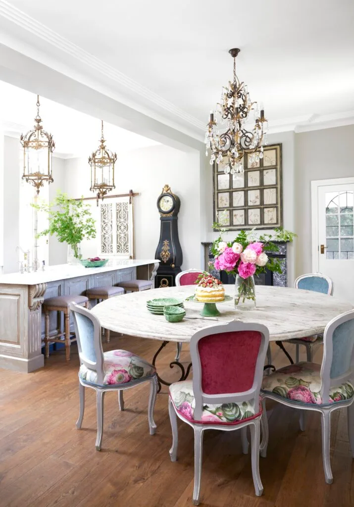 A kitchen dining area with a French provincial style dining table.