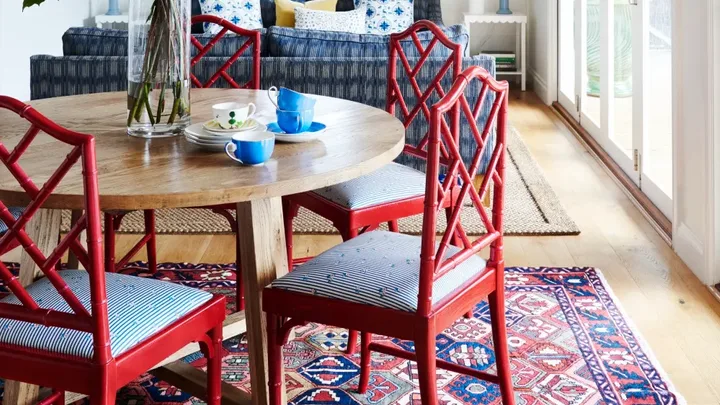 Dining and living area with pops of red and blue.