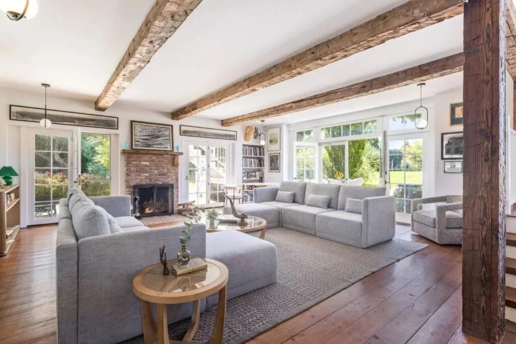 Drew Barrymore Hamptons home for sale living room with exposed beams