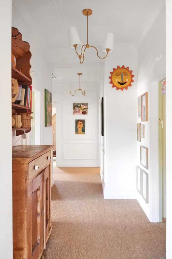 Olli Ella cofounder Chloe Brookman home hallway with art