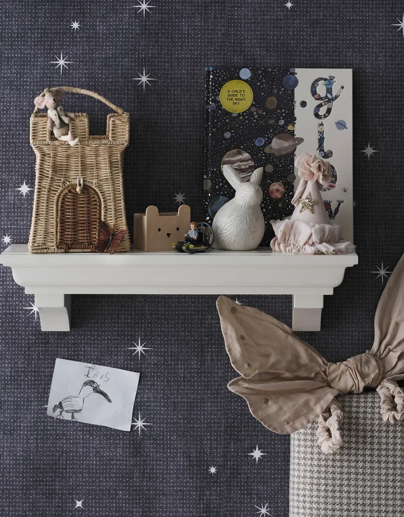 A kid's bedroom with an open shelf holding toys.