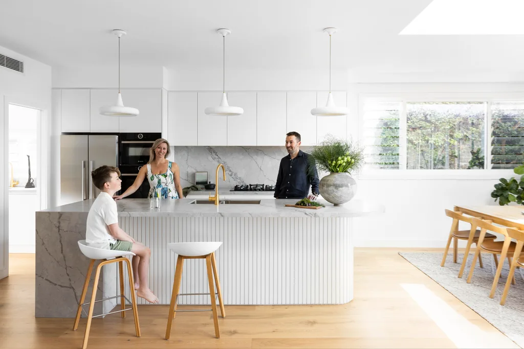 Owner's Lisa and Matt and son Riley in the kitchen.