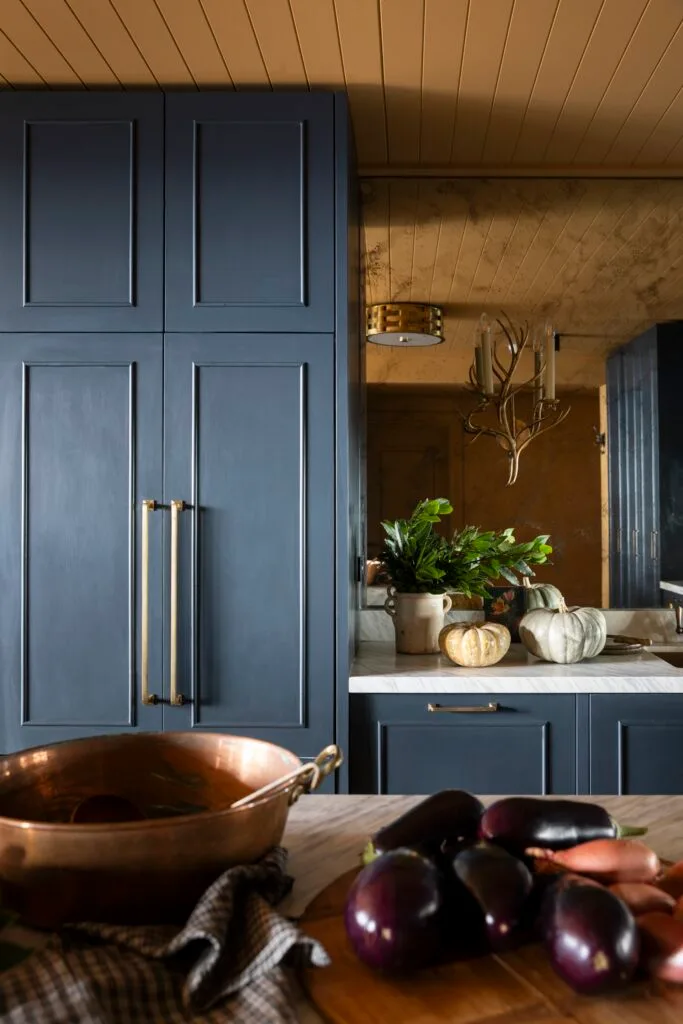 Dark blue shaker-style kitchen cabinets.