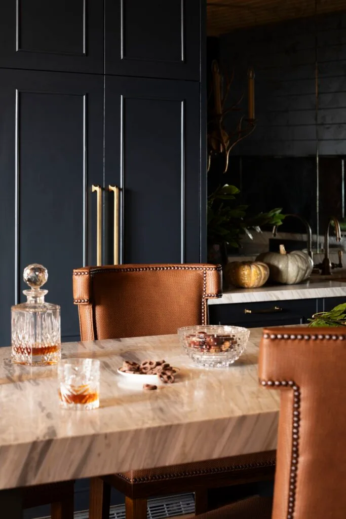 Vinyl brown bar stools at a marble table.