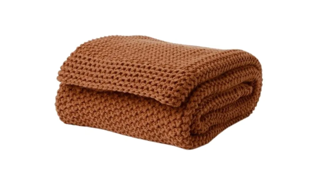 The Australian House & Garden Norwood Throw in Earth which is a warm ochre shade