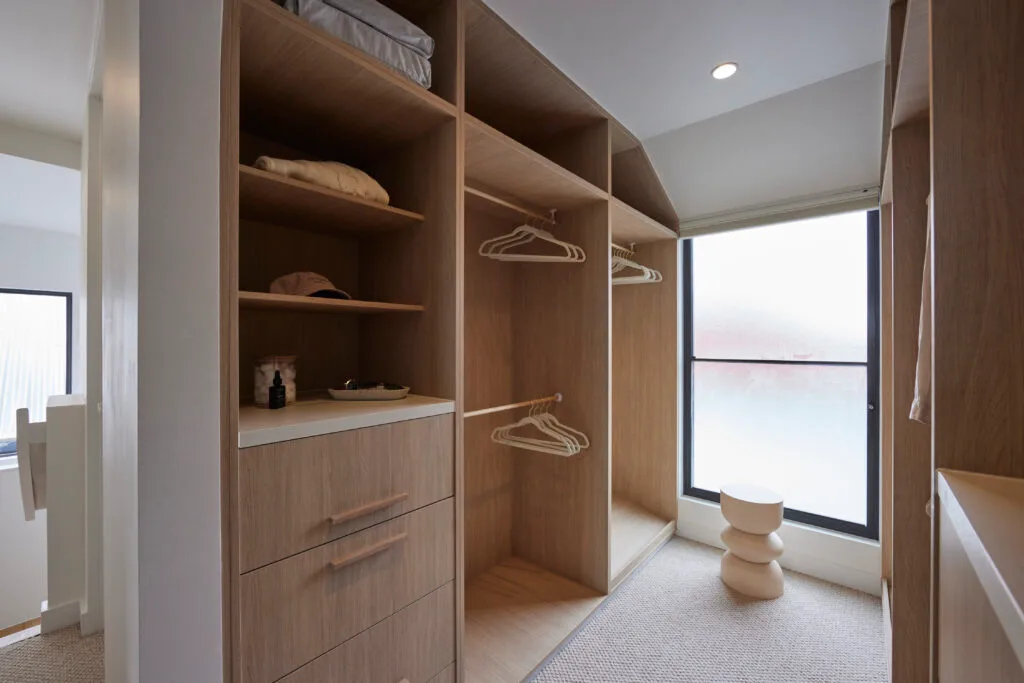 Brad and Mel from Dream Home's new ensuite has timber shelves and a curved stool