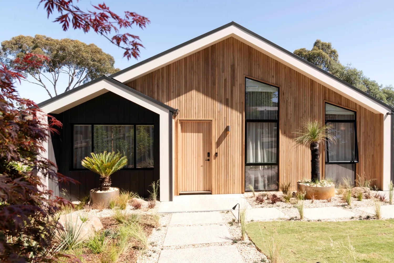 Elle's home exterior is cladded in timber