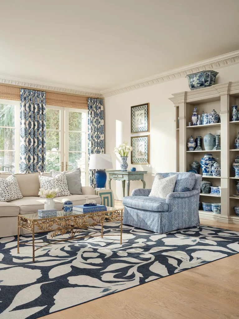 One of Nicky and Kathy Hilton's Ruggable rugs in a Hamptons style blue and white dining room.