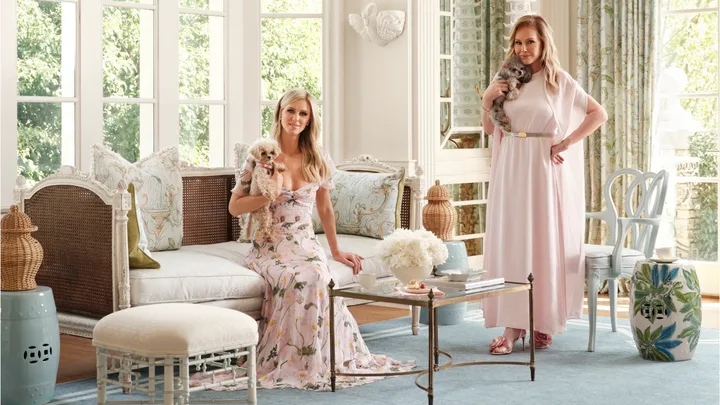 Nicky and Kathy Hilton sit on lounges on a pale blue Ruggable rug from their collection