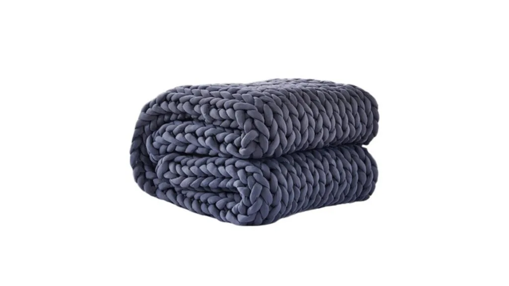  A folded chunky knit blanket from Temple & Webster.