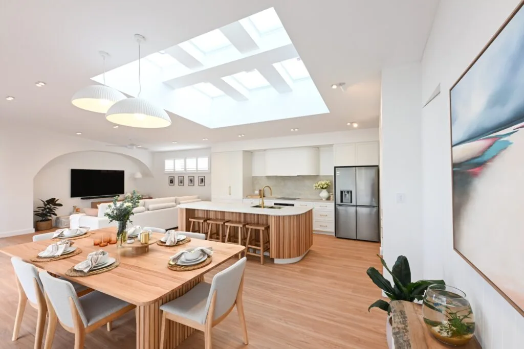 Rhys and Liam's Dream Home open plan dining and living space with a large skylight above.