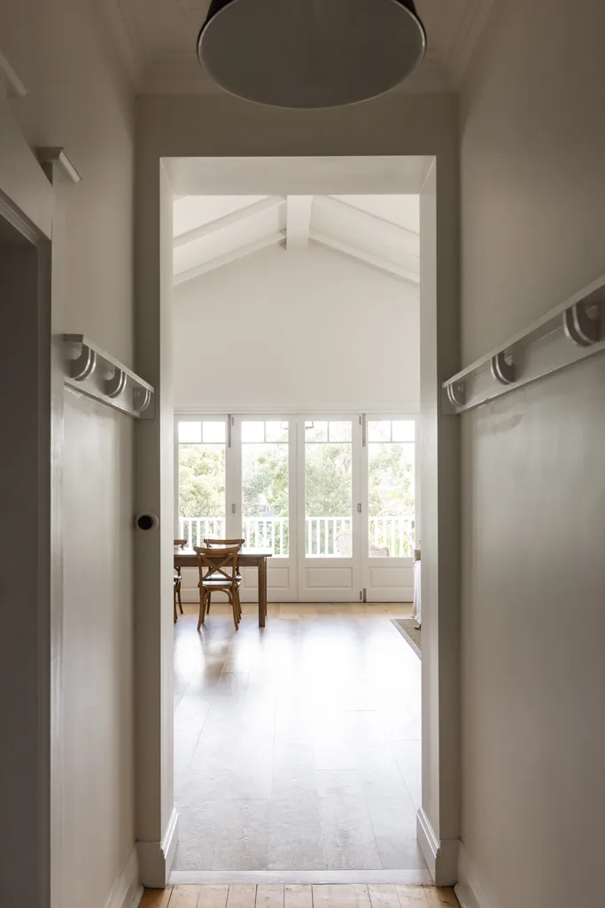 A hallway leading into the living and dining areas.